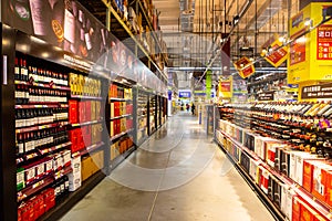 A shelf of wines in a supermarket