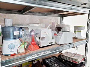 Shelf with second-hand appliances inside a store