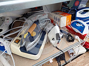 Shelf with second-hand appliances inside a store