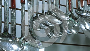 shelf in the store with cutlery