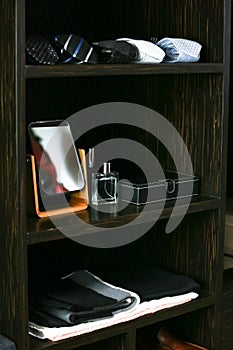 Shelf of ties, towels and accessories