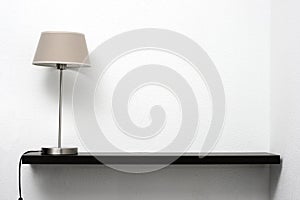 Shelf on the wall with lamp