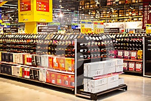 A shelf of wines in a supermarket