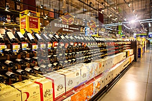 A shelf of wines in a supermarket