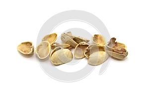 Shell pistachios close-up on isolated white background
