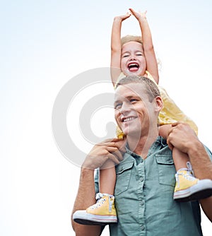 Shell reach for the starts for him. Shot of a young father carrying his daughter on his shoulders.