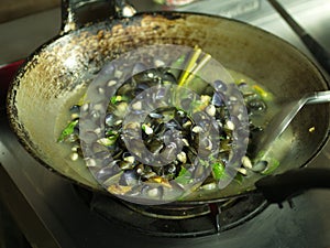 Shell Soup with Garlic, Chilli , Mint and Basil. Traditional Northeast of Thailand food - Esan Food name Pad Hoy with Horapa