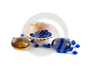 Shell on white background with blue crystals