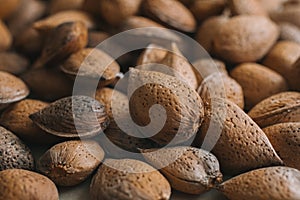 Shelled almonds as background. Close up view of shelled almonds texture and background for designers. Heap of almonds background.