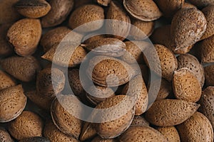 Shelled almonds as background. Close up view of shelled almonds texture and background for designers. Heap of almonds background.