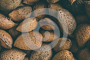 Shelled almonds as background. Close up view of shelled almonds texture and background for designers. Heap of almonds background.