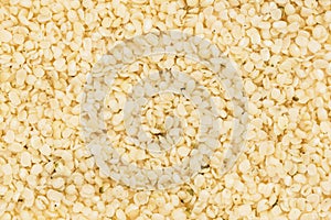 Shelled hemp seeds background