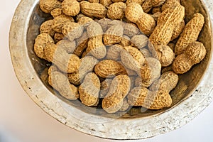 Shelled peanuts in metal bowl