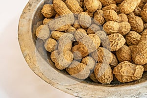 Shelled peanuts in metal bowl