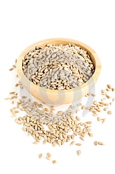 Shelled sunflower seeds in wooden bowl