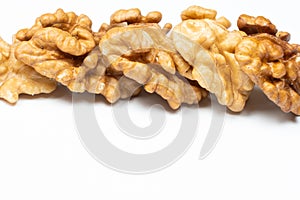 Shelled walnuts on a white background close-up
