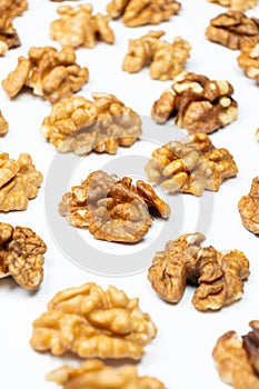 Shelled walnuts on a white background close-up