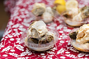 Shellfish on sale in the local market, Puerto Montt, Chile. With selective focus