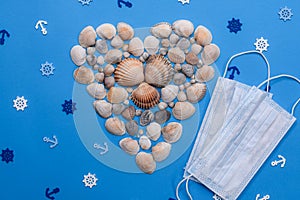 shells in the form of a heart on a blue background. Medical masks. Anchors and sea rudders. layout