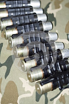 Shells in a tape over camouflage