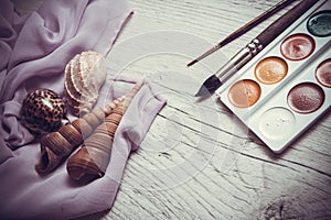 Shells and watercolor paints