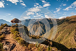 Shelter in sunrise at the top of the Machu Picchu mountain 3,061 m. View of the ancient city of Machu Picchu, Peru. Lost Incan