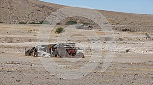 Shelter of tin and trash in desolate Kalahari desert