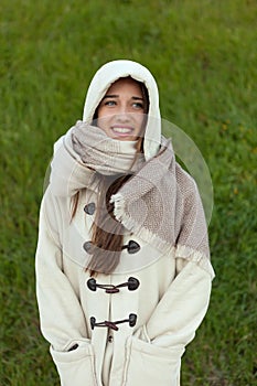 Sheltered girl with hood and scarf