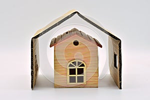 Sheltered miniature wooden house photo