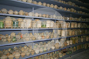 Shelves of ancient pots and vases
