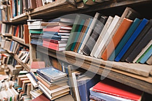 Shelves with books in the old library. Book shelves background. Old books on library shelves