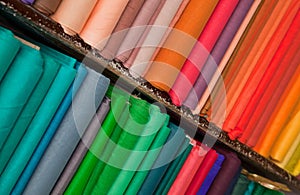 Shelves of colorful textiles and fabrics