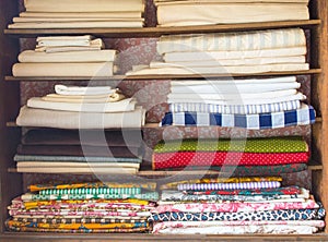 Shelves filled with colorful colonial fabric