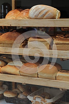 Shelves filled with freshly baked loaves of bread