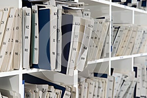 Shelves are full with folders and files of medical record, patient information