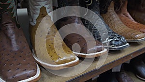 Shelves full of new cowboy boots.