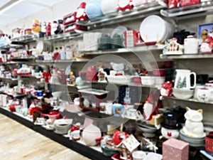 Shelves in the holiday aisle at retail store full with Christmas merchandise. Abstract blur