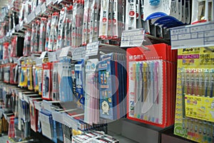 Shelves of pens in supermarket