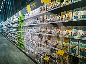 Shelves with pet food inside a supermarket in Rome in Italy. Shelves with food products for cats