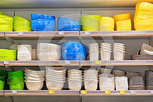 Shelves in the store with plastic storage bowls. Inexpensive alternative to subjects made from natural materials.