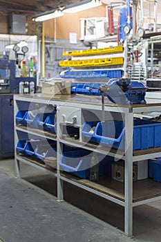 Shelves with various tools in a metallurgy workshop