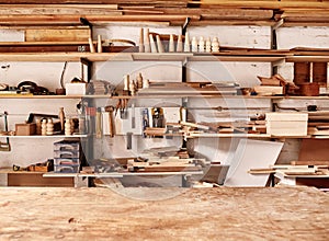 Shelves in woodwork workshop with various wooden items and tools