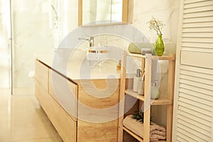 Shelving unit with toiletries in stylish interior