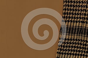 Shemagh Cloth on tan color surface background.