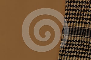 Shemagh Cloth on tan color surface background. photo