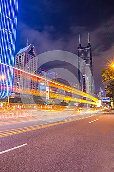 Shenzhen, China city street with lighttrail at twilight