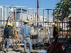 Shenzhen, China: construction workers at construction sites.