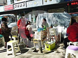 Shenzhen, China: elderly women experience health care physiotherapy.