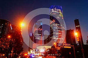 Shenzhen, China: night view of downtown bao `an, street and high-rise buildings and neon lights