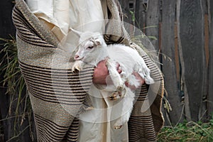 Shepherd with a sheep in his arms